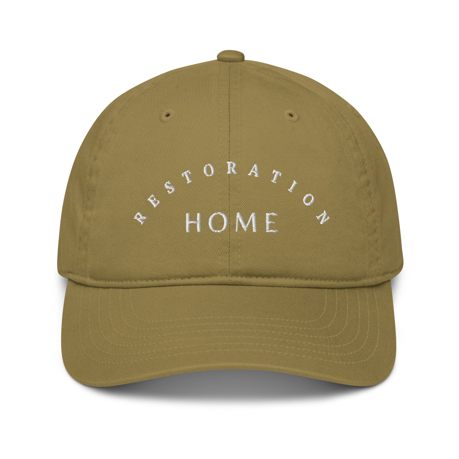 A Dark tan "dad hat" with the words Restoration Home on the front.