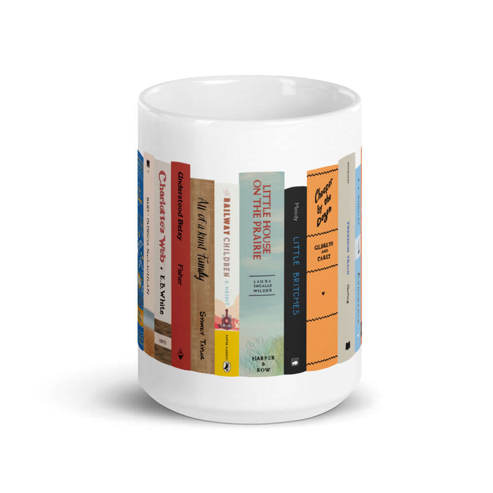 The Peaceful Preschool Mothering By The Book mug in white with a painting of a bookshelf with books on it.